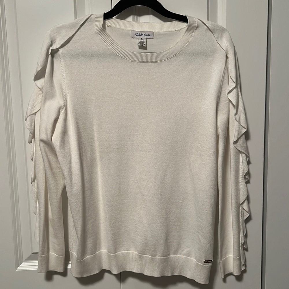 CALVIN KLEIN pullover with ruffle detail.